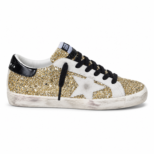 Golden Goose Star Golden Star - gold glitter low-top sneaker with white star and black heel, side view